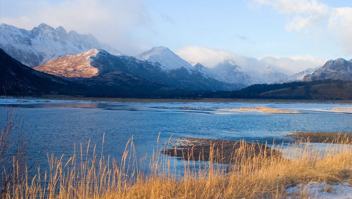 Beautiful water with mountains in the background